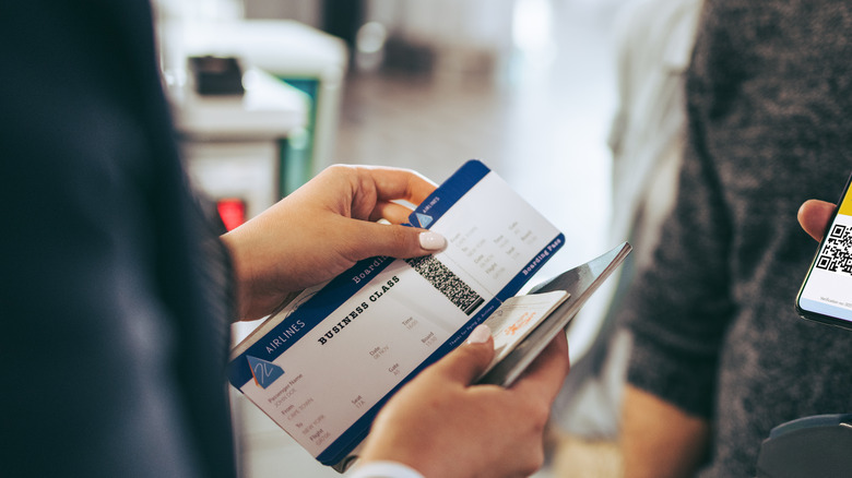 TSA worker checking boarding pass