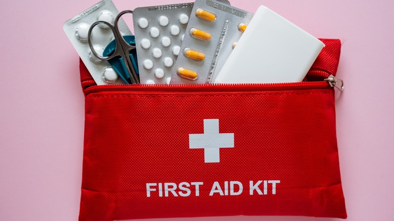 Various supplies in a cloth first aid kit bag