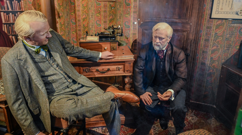 Wax figures of Thomas Edison and Gustav Eiffel in Eiffel's personal apartment in the Eiffel Tower, Paris, France