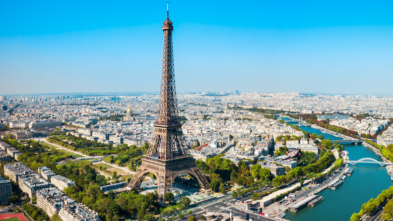 The Eiffel Tower rising above the city of Paris with the Seine River, France