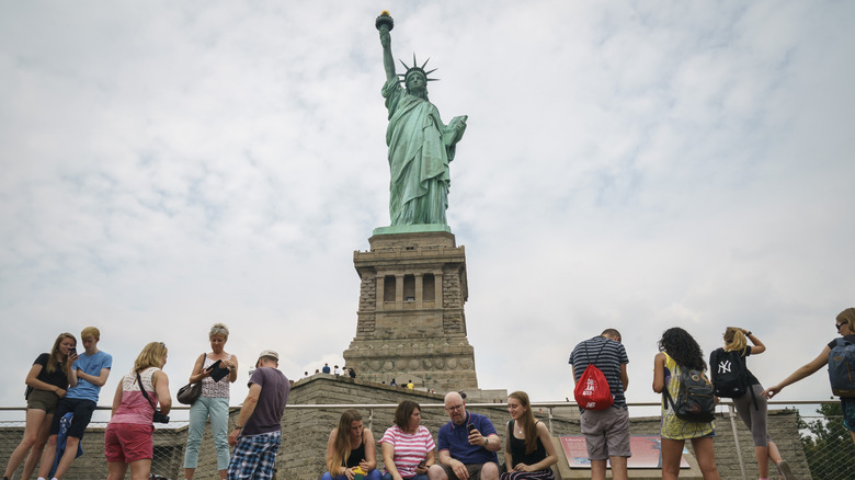Tourists outside the Statue of Liberty