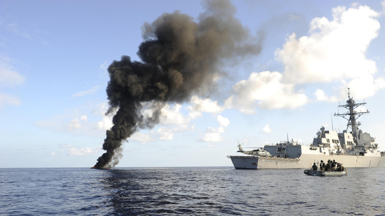 U.S. military image of the USS Farragut passing smoke from a suspected pirate skiff it disabled on March 31, 2010 in the Gulf of Aden