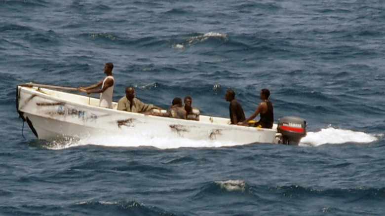 U.S. military image of pirates leaving the merchant vessel MV Faina for the Somalian shore, under the observation of a U.S. Navy ship in the Indian Ocean on October 08, 2008