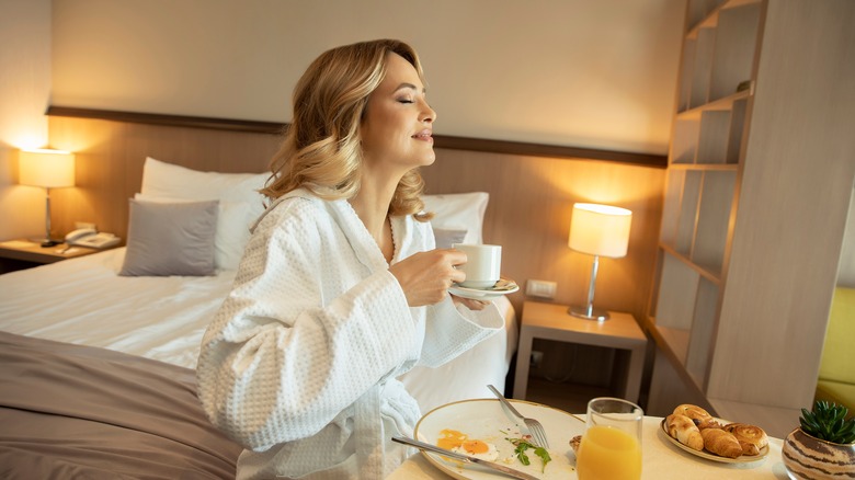 Women eating room service in robe