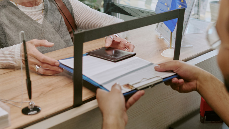 Woman getting her visa and passport