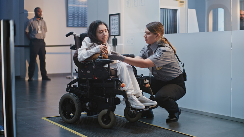 A person with a disability talking to a TSA officer