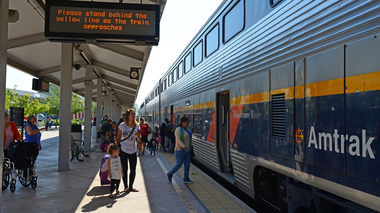 passengers get ready to board Amtrak's train at Bakersfield, headed northbound on the San Joaquin line