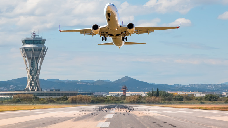 A flight taking off over Barcelona Airport in Spain