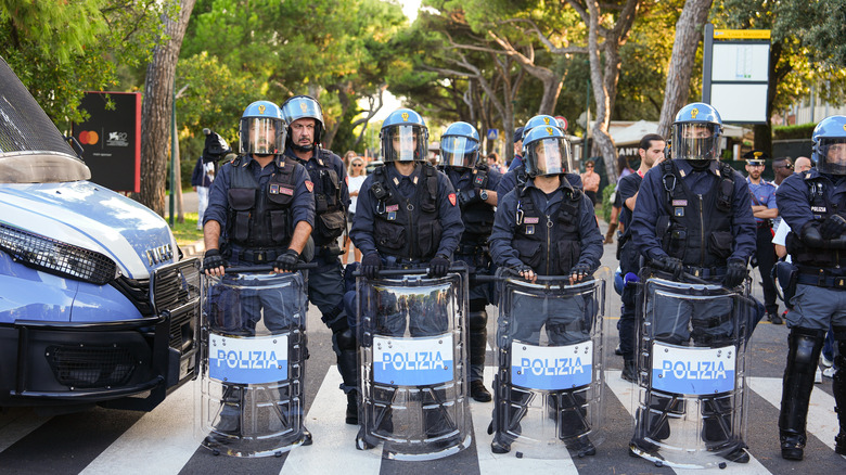 Police prevent protestors from entering the 82nd Venice International Film Festival
