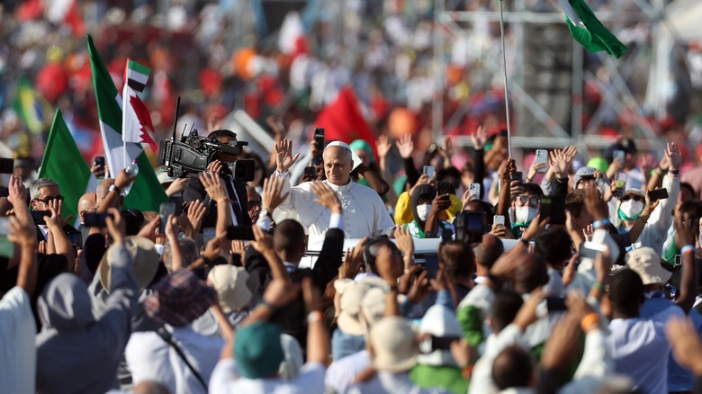 Pope Leo XIV greets Jubilee pilgrims in the popemobile in Rome