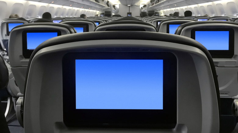 wide angle view of seat backs and entertainment screens