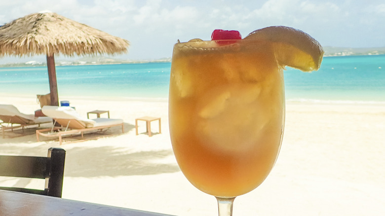 A tropical cocktail and white-sand beach on