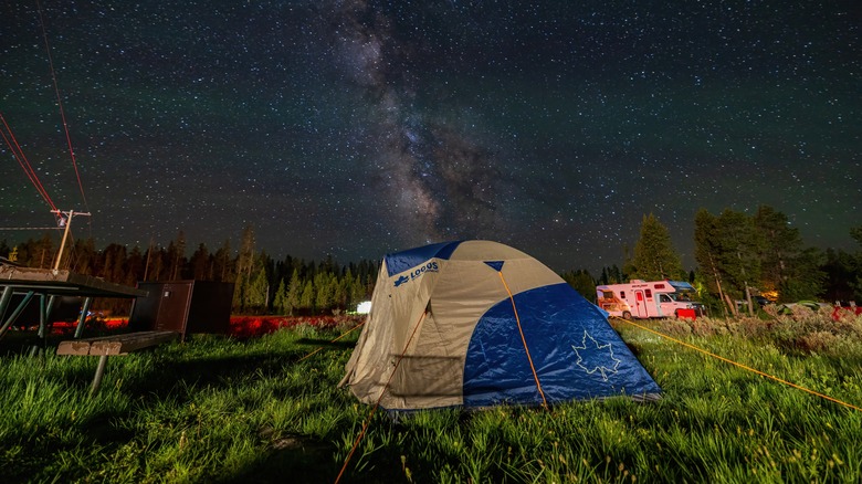 The night sky over a tent in Bridge Bay Campground.