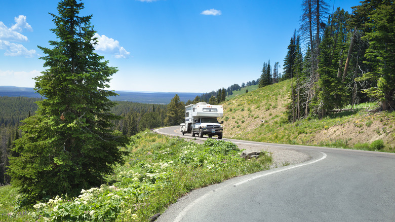 An RV driving in the Yellowstone.