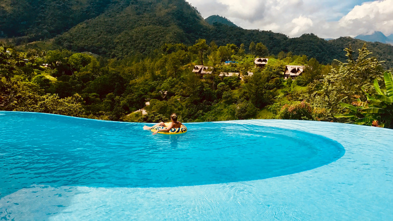 Luxury infinity pool at a hostel in Guatemala with a view of the valley