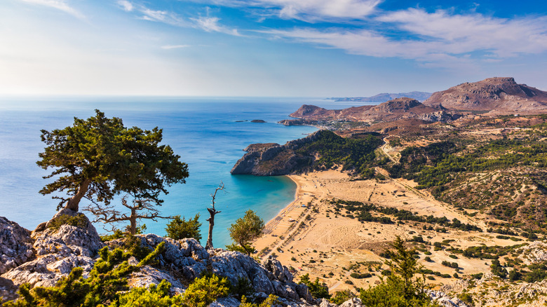 aerial view of the soft sand and turquoise waters of Tsambika Beach on Rhodes, Greece
