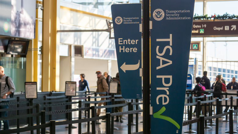 TSA PreCheck sign at airport security checkpoint