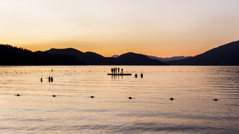 Swimming in Whitefish Lake at sunset