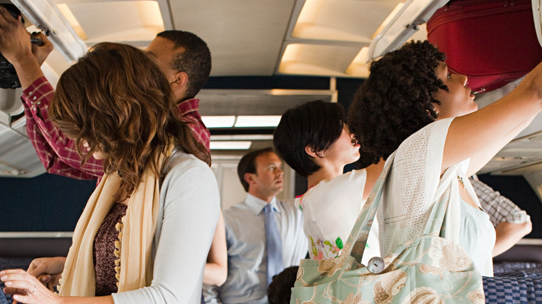 Passengers retrieving their belongings