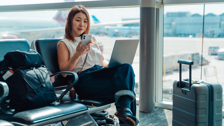Person waiting at an airport gate