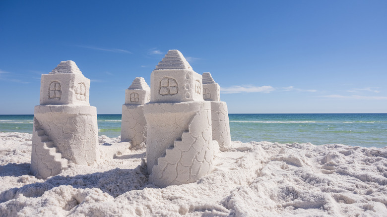 A sandcastle made of fine white sand at Opal Beach in Pensacola, Florida