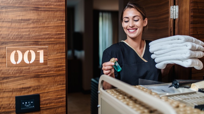 Hotel housekeeper with trolley