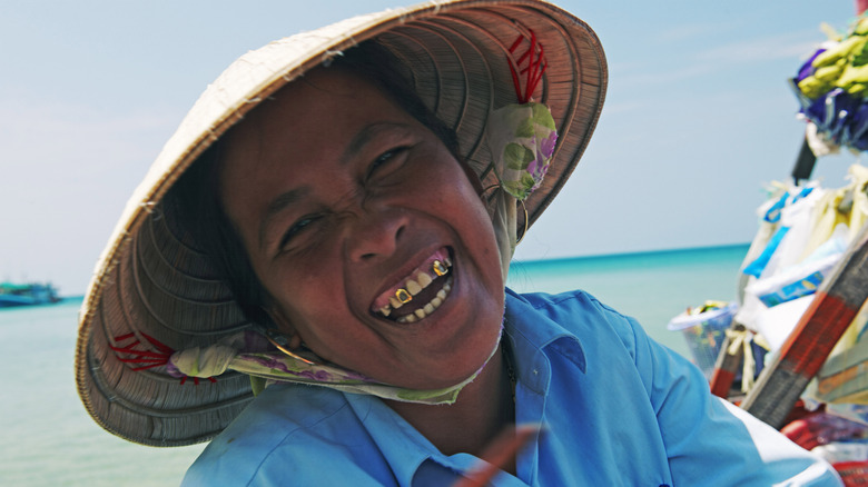 A local Phú Quốc woman smiles at the camera