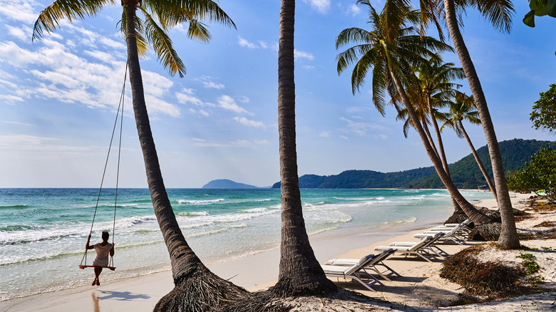 A woman relaxing on a swing at Sao Beach, Phú Quốc