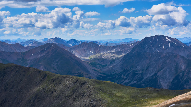 The view of the Rocky Mountains on a sunny day from the top of Mt. Elbert in Colorado