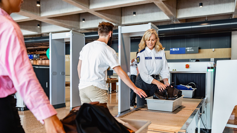 Man going through security at airport