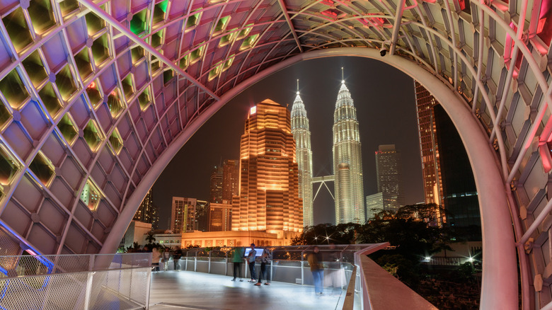Night view of the Petronas Twin Towers through Saloma Link Bridge in Malaysia