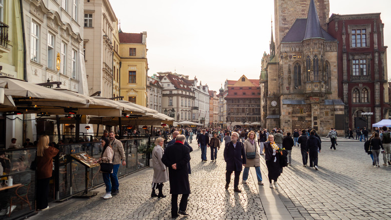 Tourists walking around Old Town Square in Prague