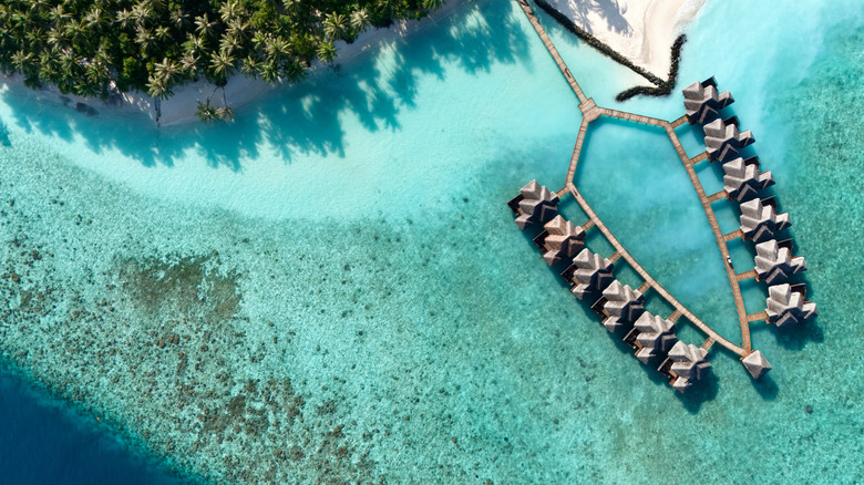 Aerial view of over the water bungalows in the Maldives