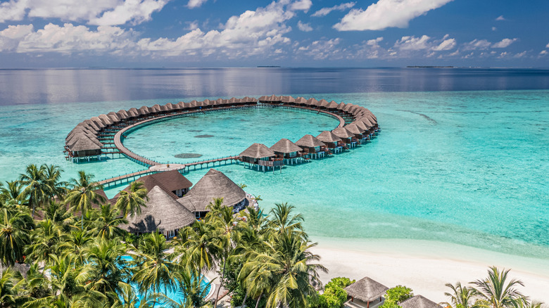 View of over the water bungalows and turquoise water in the Maldives