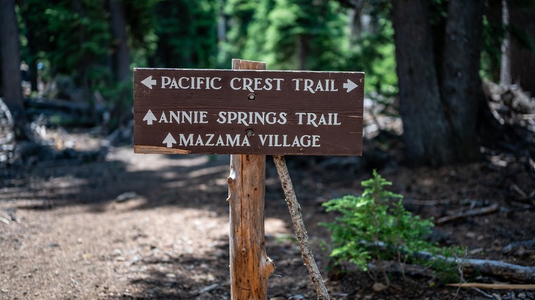 Pacific Crest Trail sign in Crater National Park points to Washington village Mazama