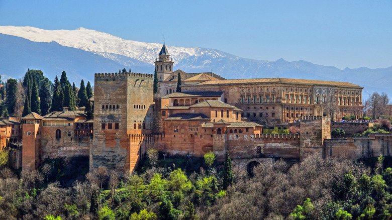 The Alhambra on top of a hill overlooking Spain's city of Granada