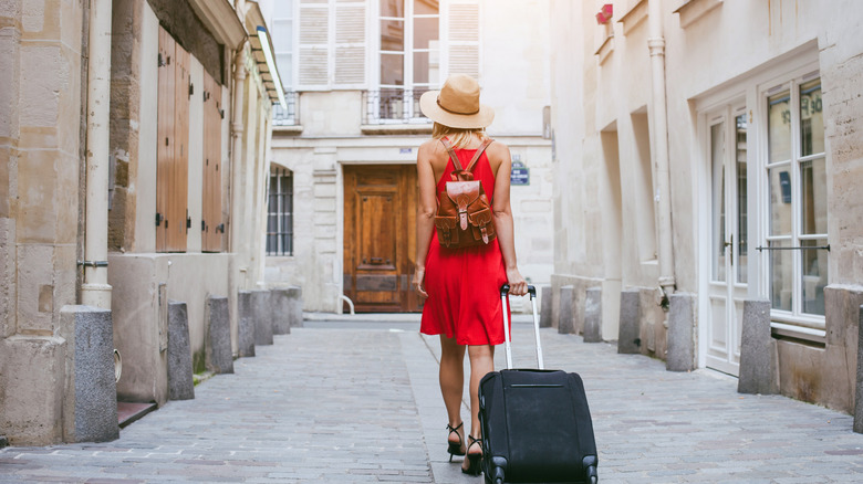 Tourist walking with a suitcase in Italy