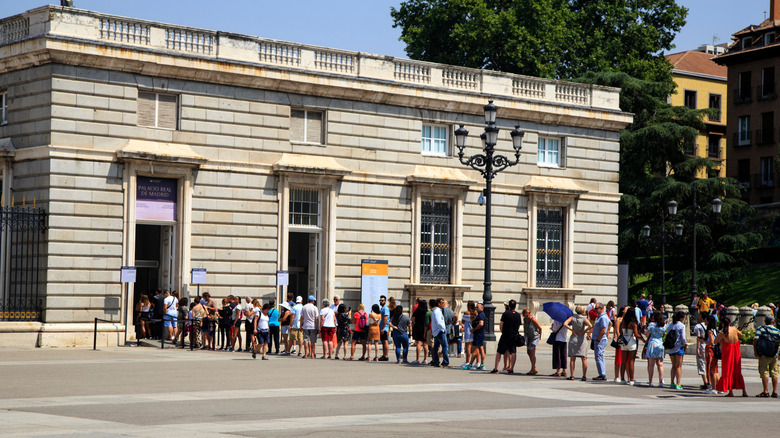 People waiting in line at the Royal Palace of Madrid