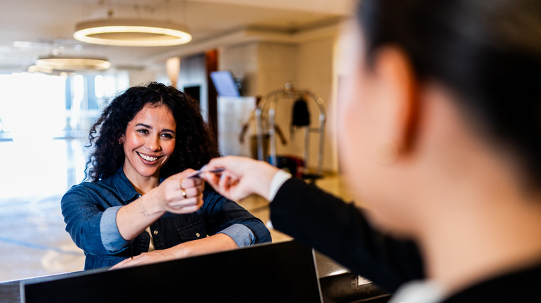 Woman checking into a hotel