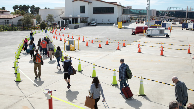 Passengers on an uncrowded tarmac at Santa Barbara Airport