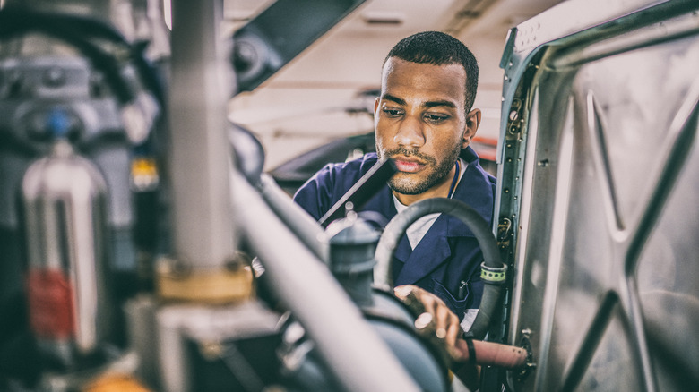 Mechanic working on a plane