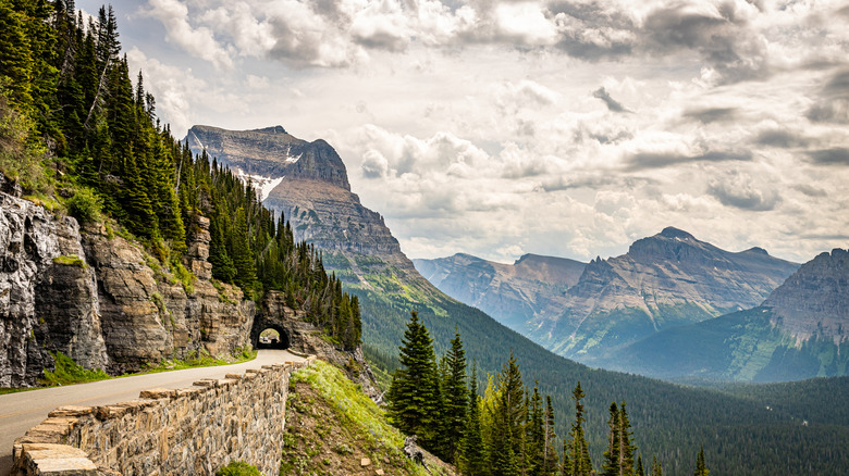 Going-to-the-Sun Road with a mountain peak in background during sunset