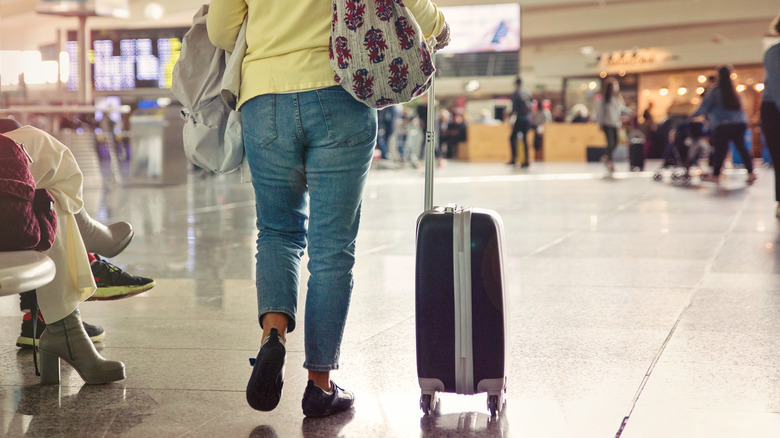 A person walking through an airport