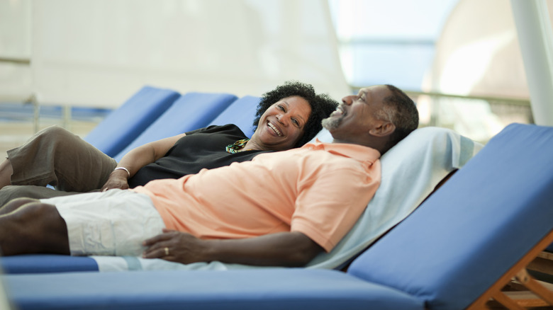 Couple lounging on a cruise ship
