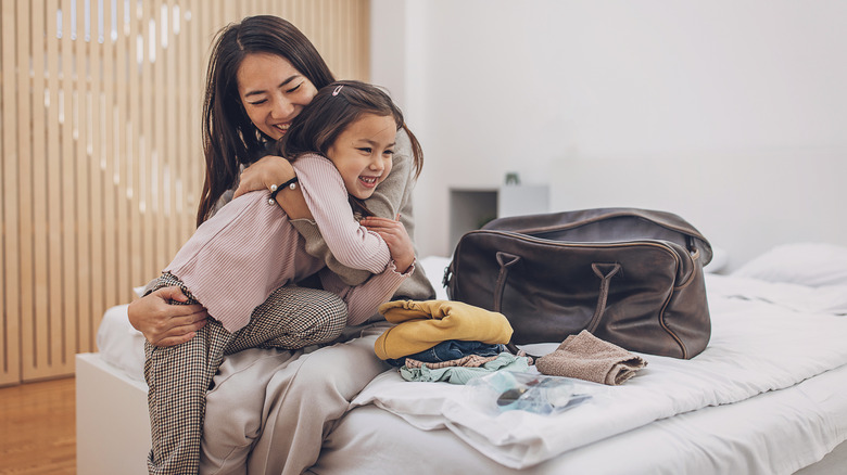 Mom and daughter in hotel room