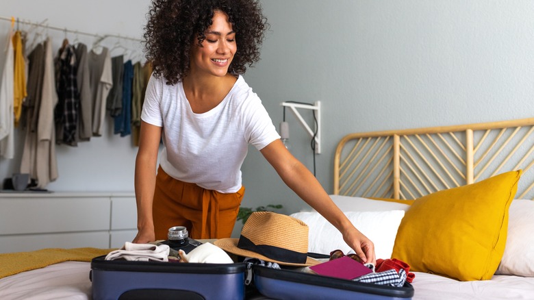 Woman packing a suitcase