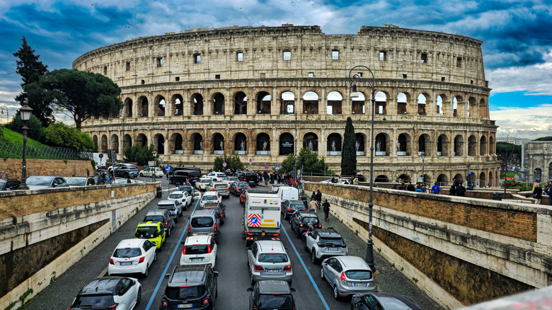 Cars stuck in gridlock traffic in front of Rome's Colosseum.