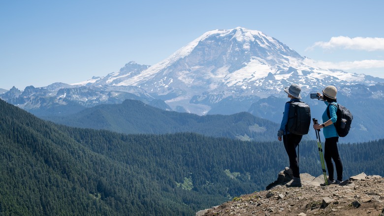 Hikers taking photos of Mount Rainier