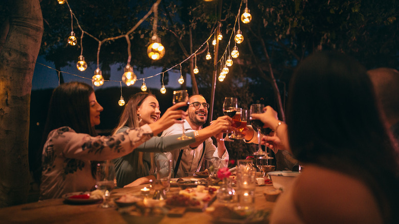 Friends toasting at Italian dinner
