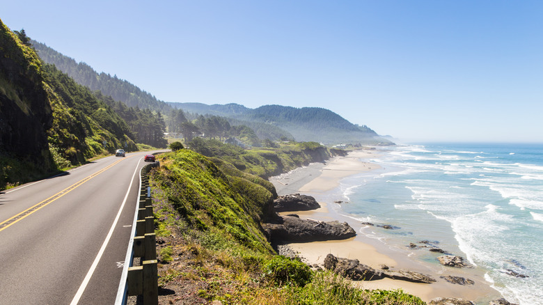 A road runs along the Pacific Coast of California